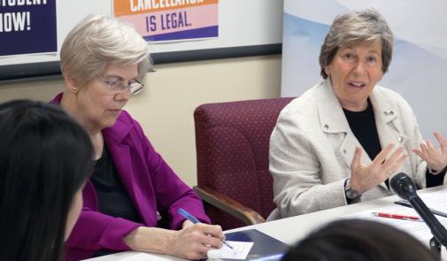 Weingarten, right, with Sen. Elizabeth Warren at a discussion in Boston on March 18 about the student debt crisis. Credit: Adam Derstine