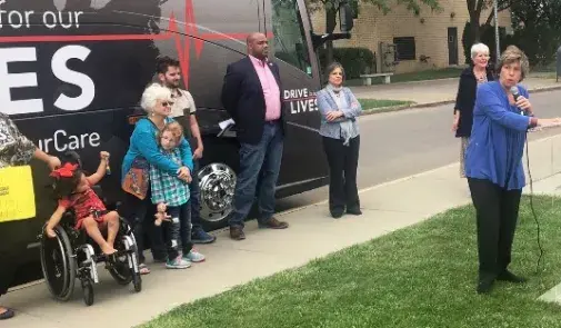 Weingarten speaking at Drive for Our Lives bus stop