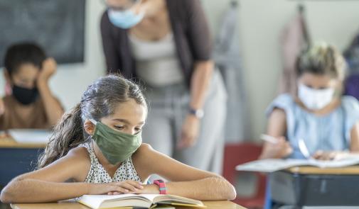 kids in classroom wearing mask