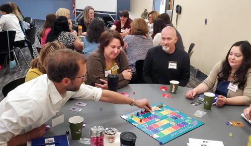 JEDI participants play Finish Line, a board game where they adopt different student identities to understand student challenges on campus. Photo courtesy of FASCC.