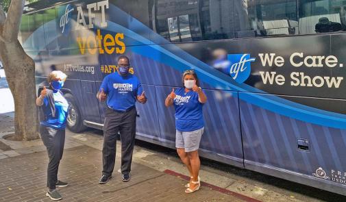 Photo of AFT officers in front of the AFT Votes bus