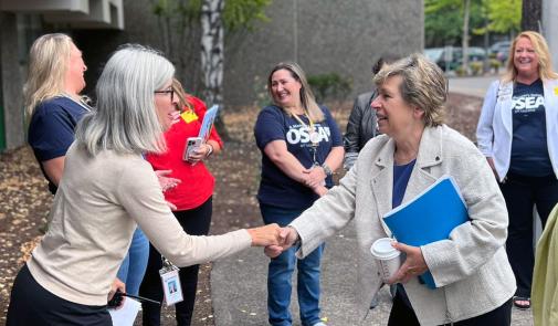 Photo of AFT President Randi Weingarten being greeted by Greenway Principal Jennifer Whitten.