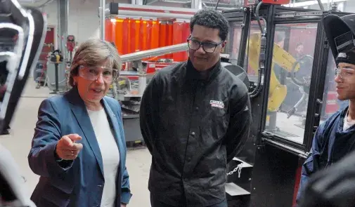 Weingarten, left, with students at Corcoran High School in Syracuse, NY, on Oct. 16, 2023.