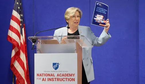 AFT President Randi Weingarten speaking at a podium