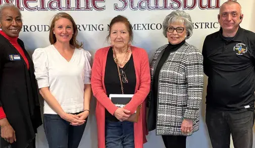 Federation of Indian Service Employees President Sue Parton, center, stands with U.S. Rep. Melanie Stansbury (D-N.M.), second from left, along with federal employees and activists.