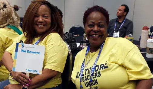 Two PSRP members of the Baltimore Teachers Union enjoy their divisional meeting.