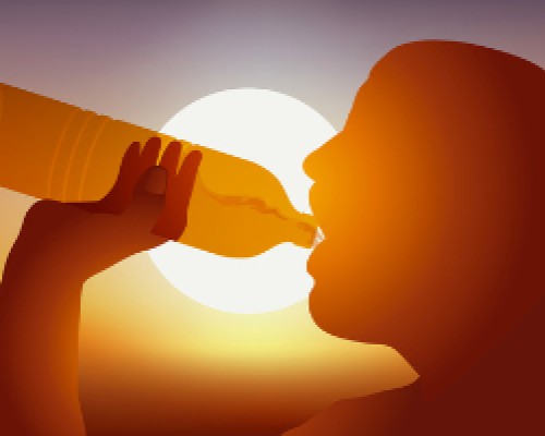 Photo of person drinking from a water bottle with the sun in the background