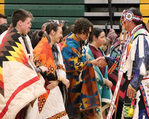 Graduating seniors are honored at the school district’s powwow, Rochester, Minn. Courtesy of Tucker Quetone.