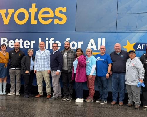 Weingarten (fifth from left) in Rochester, Minn., on Oct. 15 with educators, including congressional candidate Jake Johnson, during the AFTvotes bus tour. Credit: AFT