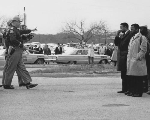 John Lewis (foreground, at right) in Selma, Ala., on March 7, 1965, before he and other voting rights activists were beaten by state troopers on what became known as “Bloody Sunday.” Credit: Courtesy of U.S. Department of State, GPA Photo Archive