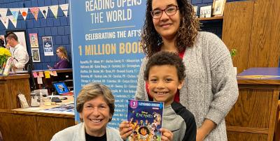 Photo: Jayveon, a 3rd grader at Cloud Elementary with his mother, Victorya and AFT President Randi Weingarten at a Reading Opens the World event with AFT Kansas and United Teachers of Wichita.