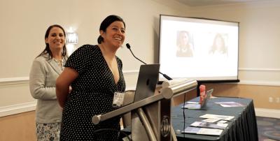 Photo of Wendy Salcedo-Fierro (at microphone) and Taryn Snyder speaking at AFT TEACH 2023