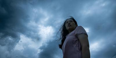 woman with storm clouds