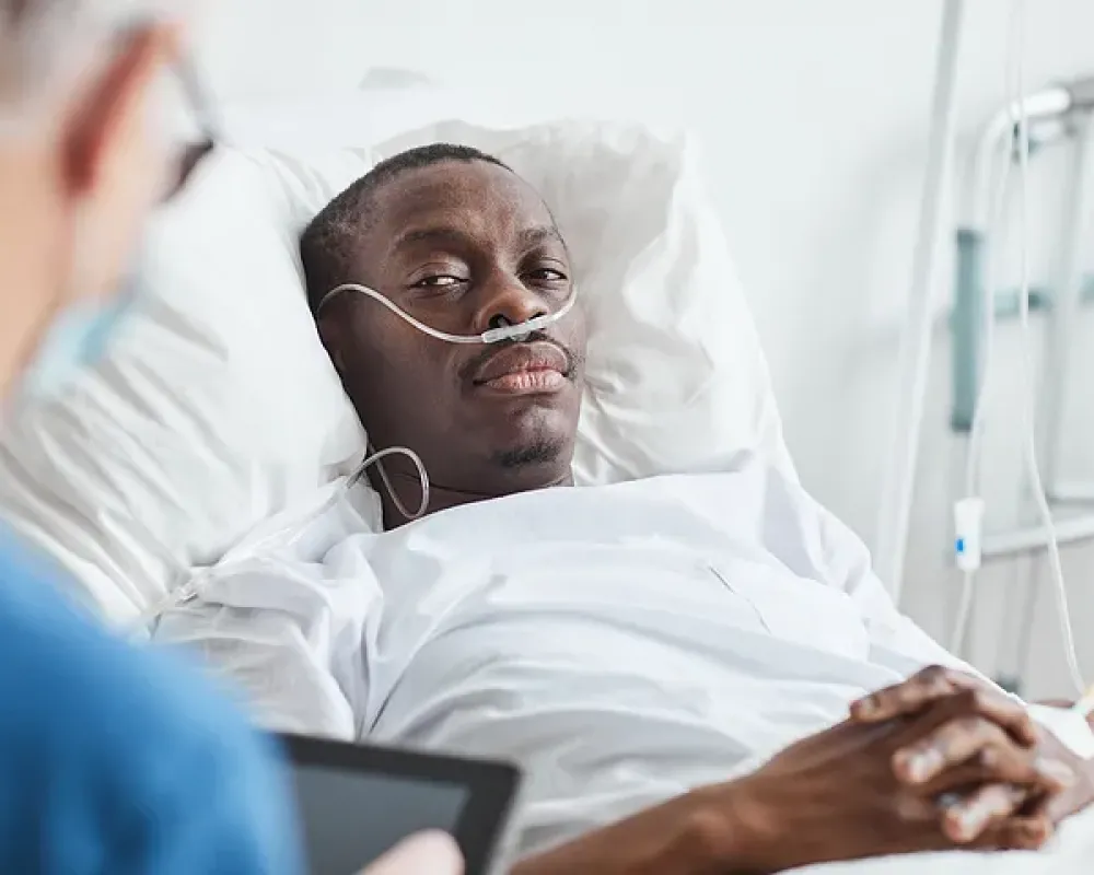Photo of man in hospital bed