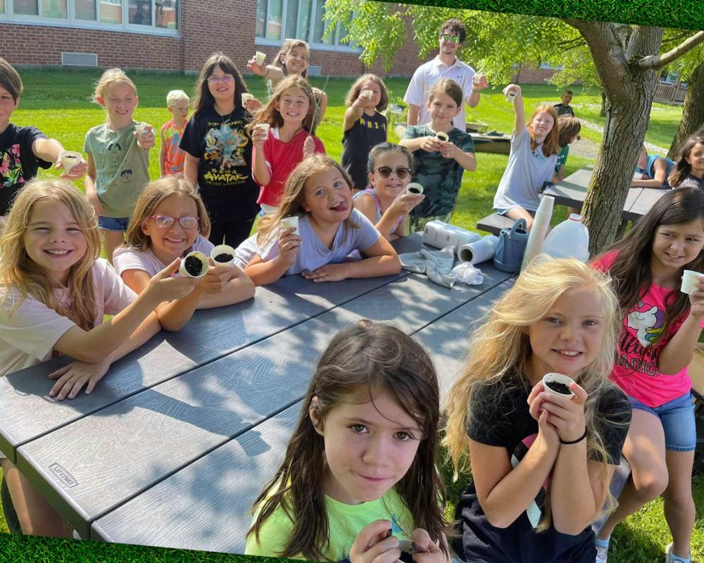 Photo of students during a hands-on lesson about planting seeds.