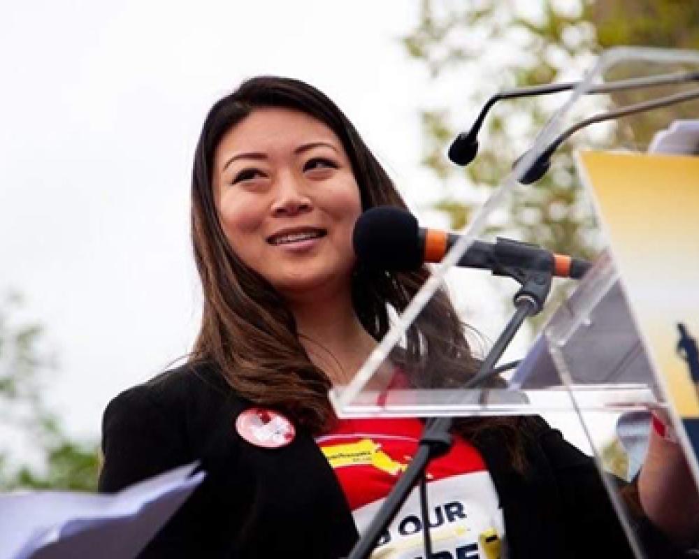 Jessica Tang pictured speaking at a podium