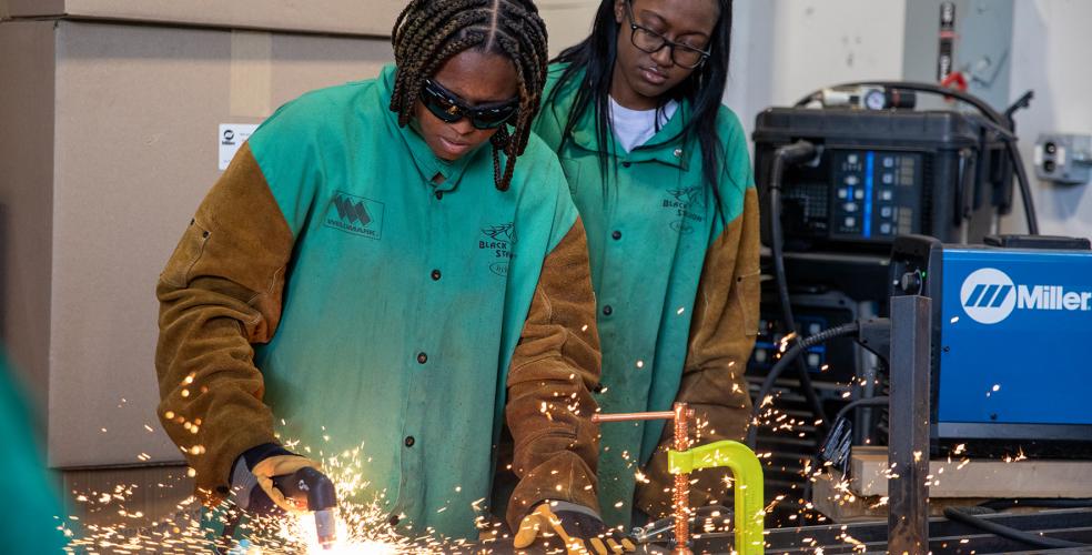 Photo of students welding