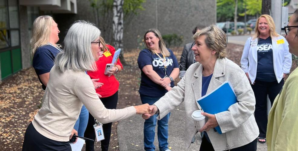 Photo of AFT President Randi Weingarten, right, being greeted by Greenway Principal Jennifer Whitten.