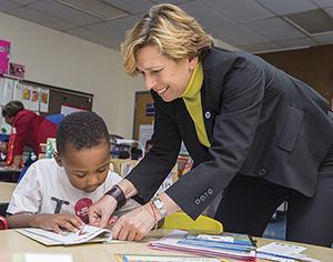 Randi Weingarten with a student at a Baltimore First Book event