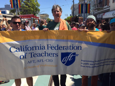 AFT Local 2121 Presdient Tim Killikelly with banner