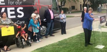 Weingarten speaking at Drive for Our Lives bus stop