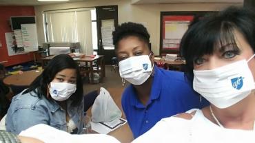 Jefferson County AFT members wearing mold masks