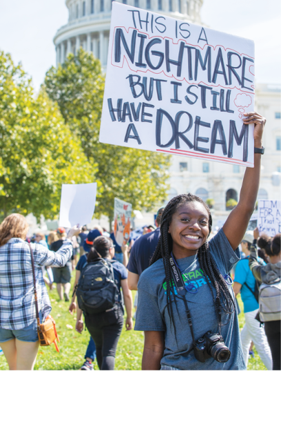 huelga climática global, chica con cartel que dice que esto es una pesadilla pero todavía tengo un sueño