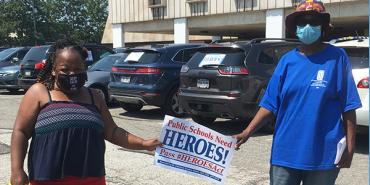 Cleveland, OH members with sign