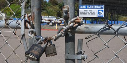 A padlock and chain closes a school