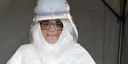 person in covid 19 protective clothing