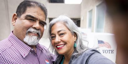 Latino couple voting
