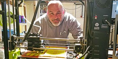 Michael Shunney pictured with 3D printer