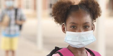 Young girl with mask