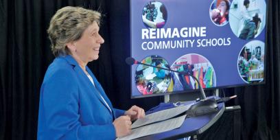 Photo of AFT President Randi Weingarten speaking. Slide says "Reimagine Community Schools"