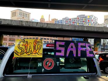 still not safe spelled out on the back window of a truck