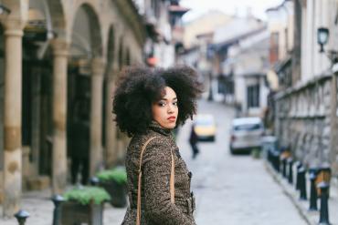 black woman looks back at camera