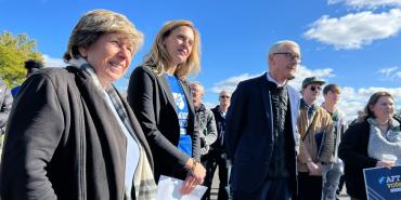 Randi with group on bus tour stop