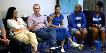 Participants talk during the Individual and Collective Identity (Hand in Hand) workshop