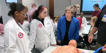 Weingarten, right, with students at Lincoln-West School of Science and Health at MetroHealth hospital in Cleveland on Oct. 24.