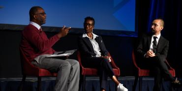 Photo of Kareem Weaver, Tanji Reed Marshall and Alonso Jaque-Pino talking about the science of reading.