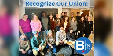 group of diverse adults pose for picture beneath digital banner that reads "recognize our union"