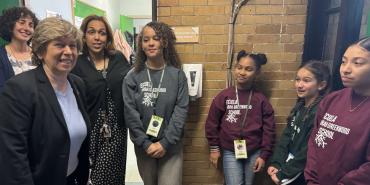 Weingarten, left, with student leaders and staff at Sarah Greenwood School in Boston on April 11.