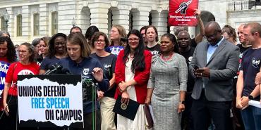 Mia McIver, from the California Federation of Teachers, addresses the press.