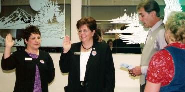 Bonnie Luisi and Merlene Martin are installed as OSEA officers in 2001.