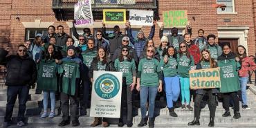 group of union members pose for picture