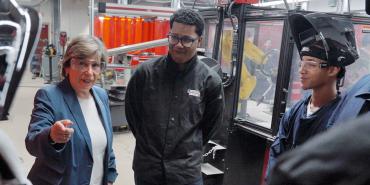 Weingarten, left, with students at Corcoran High School in Syracuse, NY, on Oct. 16, 2023.