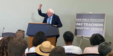Senator Bernie Sanders at a podium