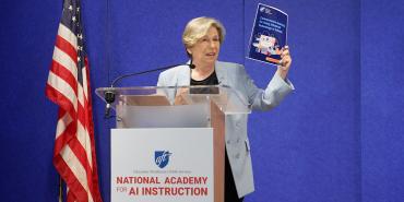 AFT President Randi Weingarten speaking at a podium