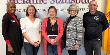 Federation of Indian Service Employees President Sue Parton, center, stands with U.S. Rep. Melanie Stansbury (D-N.M.), second from left, along with federal employees and activists.