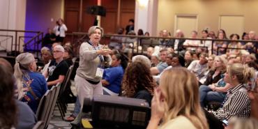 AFT President Randi Weingarten speaking in a crowd